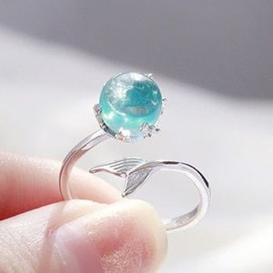 Blue water mermaid tail ring adjustable.